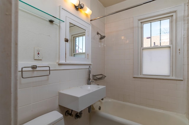 4415 Chowen Ave S Unit 201, Minneapolis, MN 55410 - bathroom featuring tile walls, bathtub / shower combination, toilet, and plenty of natural light