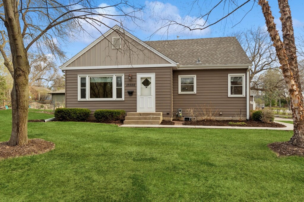 12000 Brenlyn Ln, Minnetonka, MN 55343 - view of front of home featuring a front yard and roof with shingles
