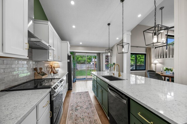 14445 Europa Ave, Apple Valley, MN 55124 - kitchen featuring stainless steel appliances, a sink, white cabinets, plenty of natural light, and recessed lighting