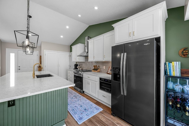 14445 Europa Ave, Apple Valley, MN 55124 - kitchen featuring stainless steel appliances, a sink, white cabinetry, vaulted ceiling, and recessed lighting