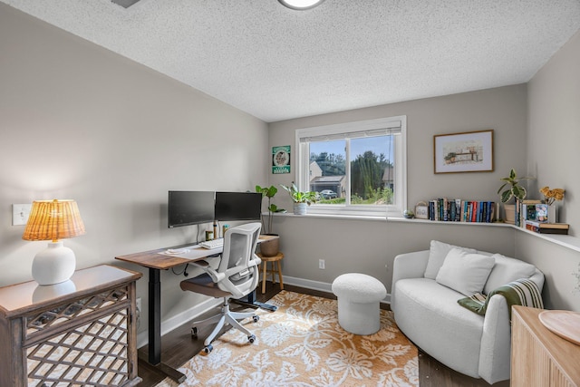 14445 Europa Ave, Apple Valley, MN 55124 - home office featuring wood finished floors, baseboards, and a textured ceiling