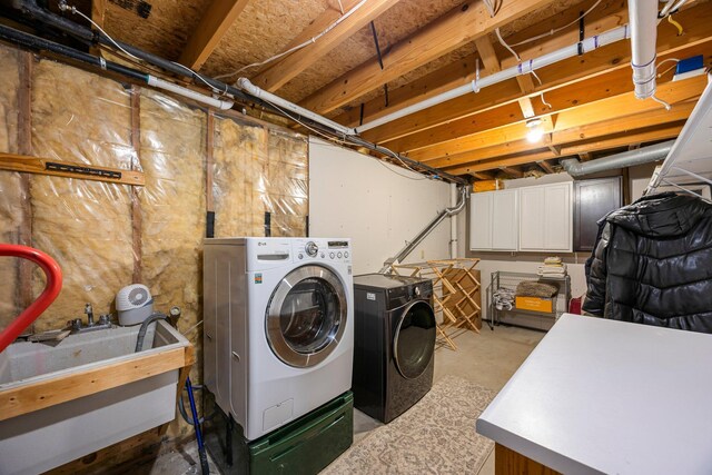 14445 Europa Ave, Apple Valley, MN 55124 - clothes washing area with washer and clothes dryer and cabinet space