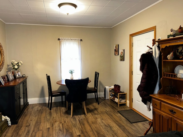 302 Church St, Saint Leo, MN 56264 - dining space with dark wood-style flooring, crown molding, and baseboards