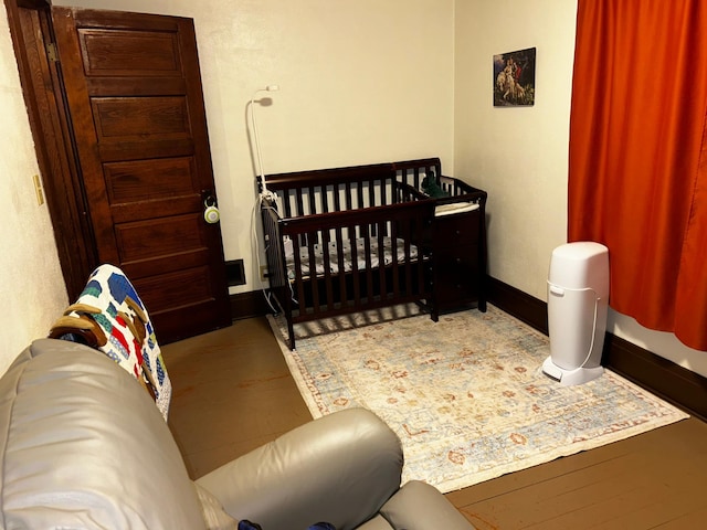 302 Church St, Saint Leo, MN 56264 - bedroom featuring baseboards and wood finished floors