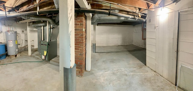 302 Church St, Saint Leo, MN 56264 - unfinished below grade area with heating unit and electric water heater