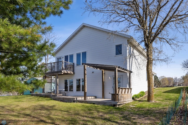 back of house with a yard and a deck
