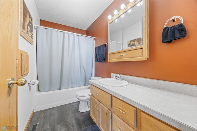 full bath with toilet, wood finished floors, shower / bath combo, visible vents, and vanity