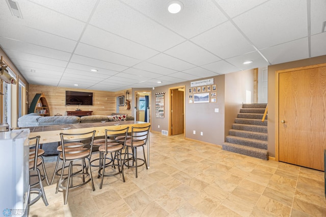 kitchen with recessed lighting, visible vents, baseboards, and a paneled ceiling