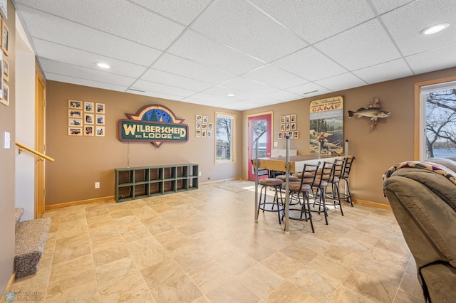 dining space featuring recessed lighting, baseboards, and a paneled ceiling
