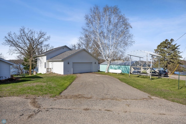 view of home's exterior with a yard, driveway, and a garage