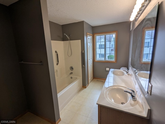 18061 96th Ave N, Maple Grove, MN 55311 - bathroom with tub / shower combination, double vanity, a textured ceiling, and baseboards