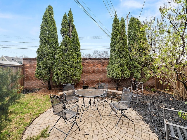 580 Snelling Ave S Unit 4, Saint Paul, MN 55116 - view of patio with outdoor dining area and a fenced backyard