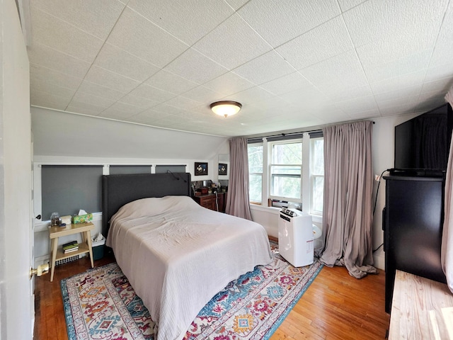 bedroom featuring wood-type flooring