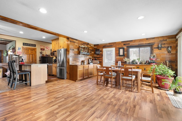 12 Oak Ave SE, Racine, MN 55967 - dining space with wooden walls, light wood-style flooring, and recessed lighting