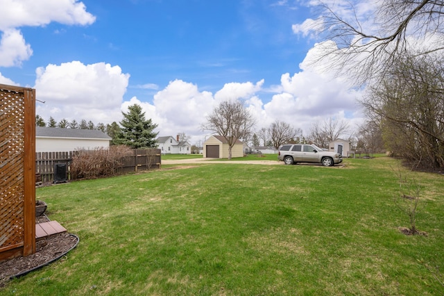 12 Oak Ave SE, Racine, MN 55967 - view of yard featuring an outdoor structure, a detached garage, and driveway