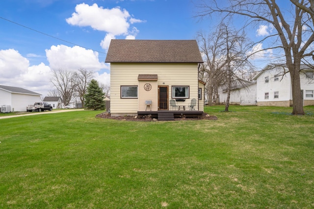 12 Oak Ave SE, Racine, MN 55967 - back of house with a deck, a lawn, and a shingled roof