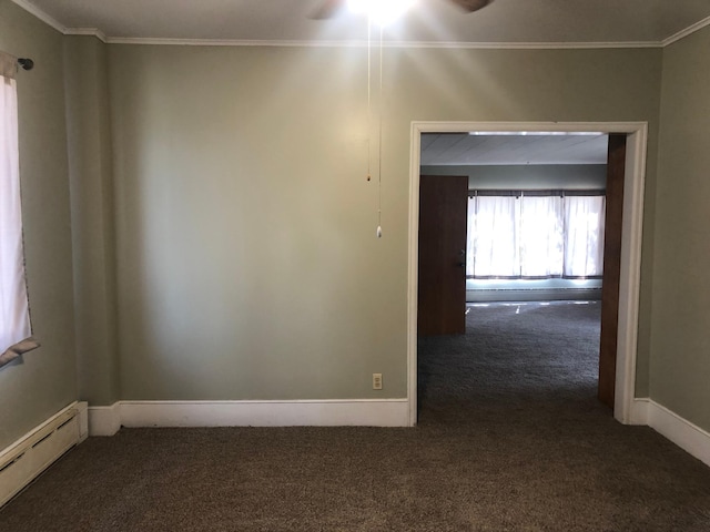 carpeted spare room with baseboards, baseboard heating, ornamental molding, and a ceiling fan