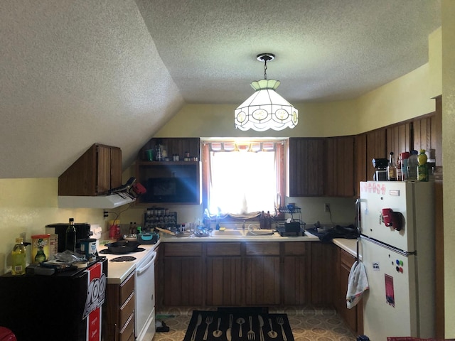 kitchen with lofted ceiling, light countertops, white appliances, and a textured ceiling