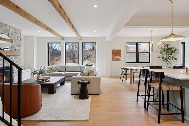 living room featuring a chandelier, light wood-style flooring, baseboards, beam ceiling, and recessed lighting
