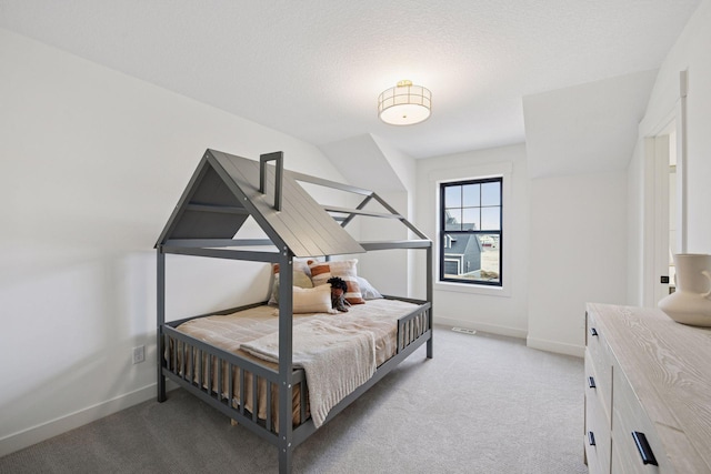 bedroom with light carpet and baseboards