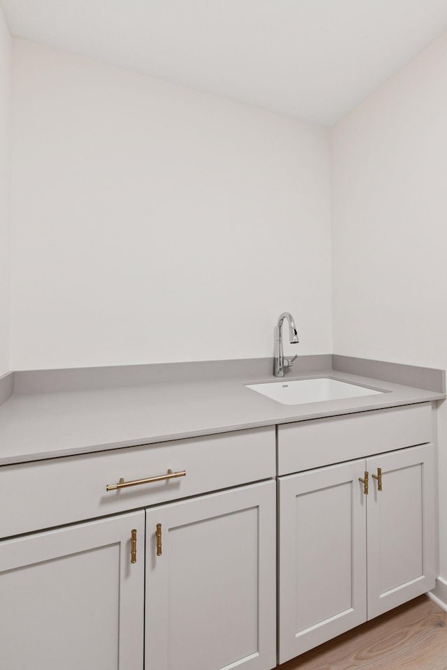 interior space with a sink and light wood-type flooring