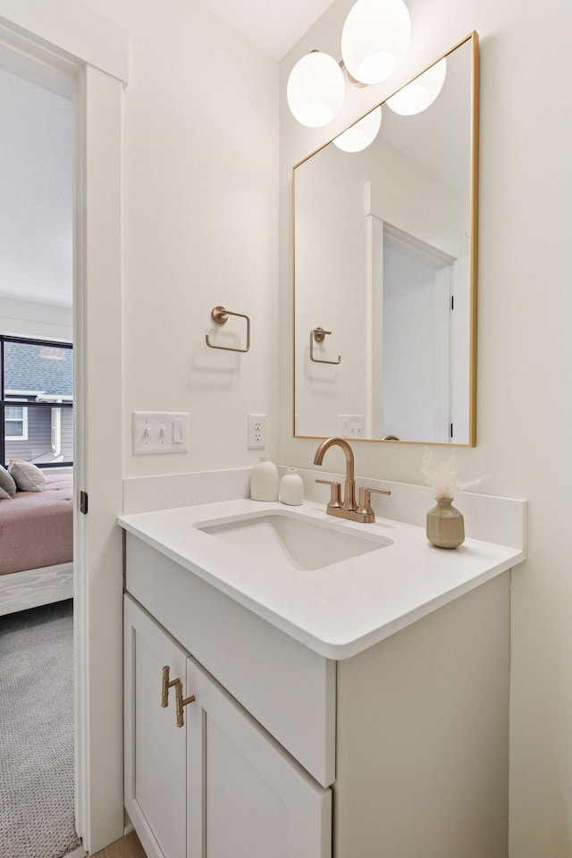 ensuite bathroom with ensuite bath and vanity