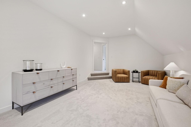 interior space featuring recessed lighting, lofted ceiling, carpet flooring, and baseboards