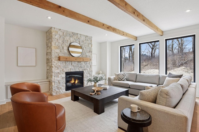5440 Rolling Hills Pkwy, Victoria, MN 55318 - living area with a fireplace, wood finished floors, beam ceiling, and recessed lighting