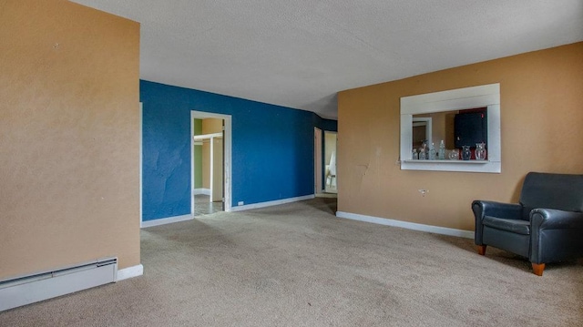 exterior space featuring a baseboard heating unit, carpet flooring, and baseboards
