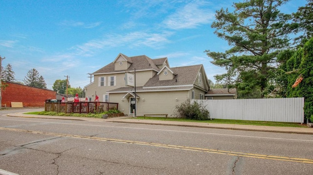 view of home's exterior featuring fence