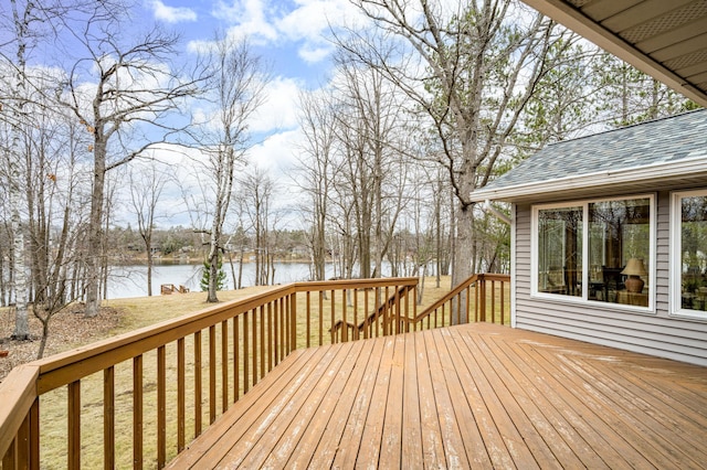 wooden deck featuring a water view
