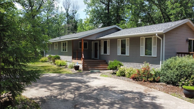 33853 Sand Rd, Sturgeon Lake, MN 55783 - ranch-style house with covered porch and a shingled roof