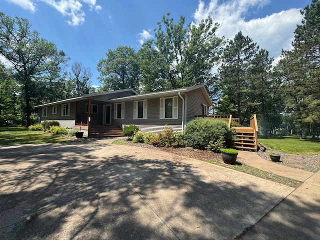 33853 Sand Rd, Sturgeon Lake, MN 55783 - ranch-style house featuring a deck, a porch, and stairway