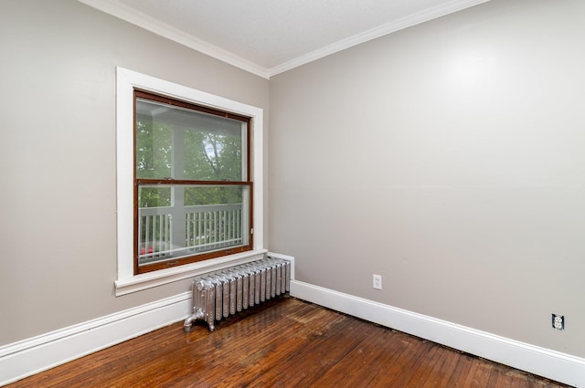 2807 17th Ave S, Minneapolis, MN 55407 - empty room featuring radiator, baseboards, hardwood / wood-style floors, and ornamental molding