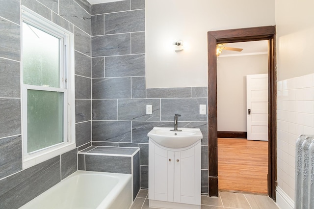2807 17th Ave S, Minneapolis, MN 55407 - full bathroom with tile walls, ceiling fan, and vanity