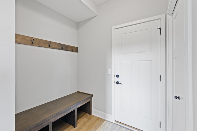 mudroom with baseboards and light wood-type flooring