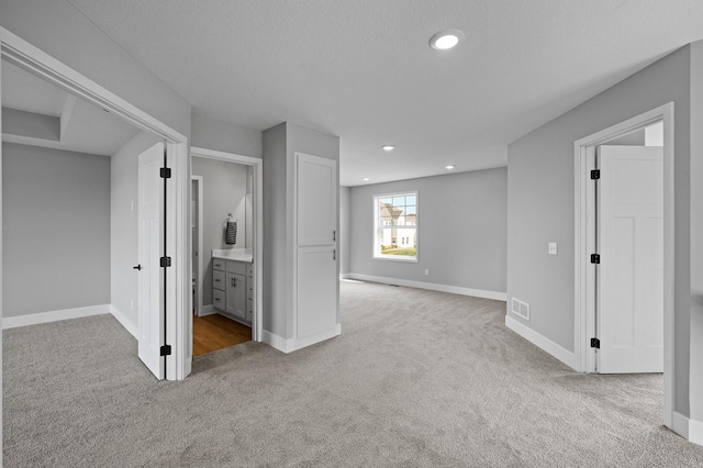 basement with baseboards, carpet floors, and recessed lighting