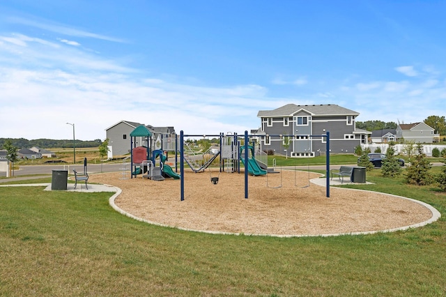 community playground featuring a lawn