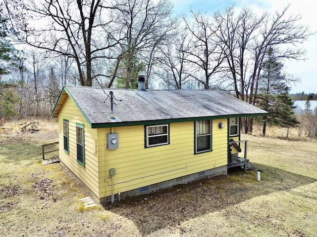 357 Glenmar Dr NE, Longville, MN 56655 - view of side of property with a shingled roof and crawl space