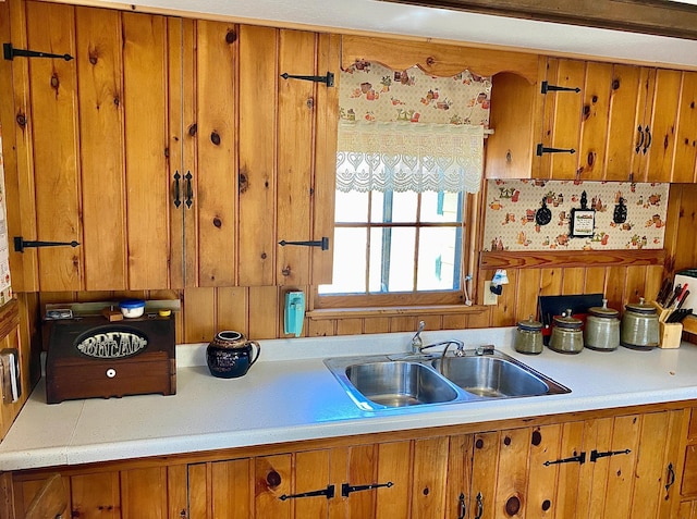 357 Glenmar Dr NE, Longville, MN 56655 - kitchen with light countertops, brown cabinetry, and a sink