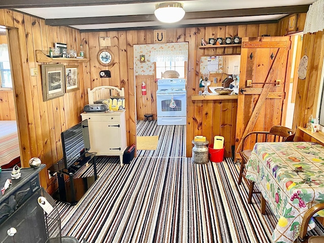 357 Glenmar Dr NE, Longville, MN 56655 - carpeted bedroom featuring beam ceiling, wooden walls, and multiple windows