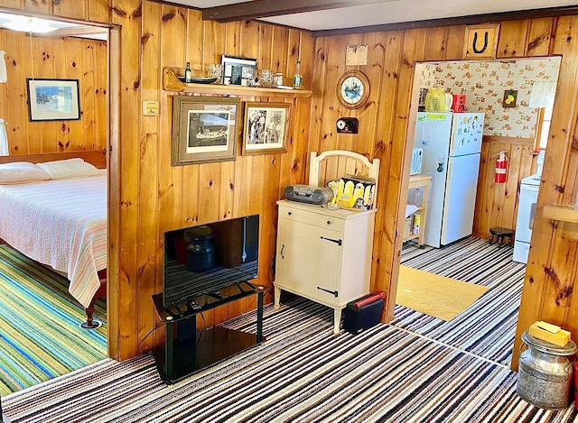 357 Glenmar Dr NE, Longville, MN 56655 - interior space featuring beam ceiling, carpet, wooden walls, and white appliances