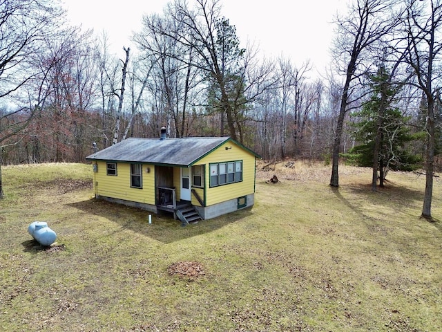 357 Glenmar Dr NE, Longville, MN 56655 - view of front of property with a front yard and a forest view