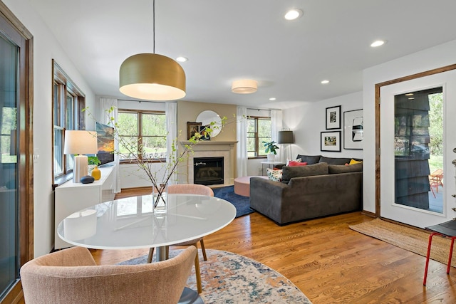 5 Shore Rd, North Oaks, MN 55127 - living room featuring light wood-type flooring, recessed lighting, and a glass covered fireplace