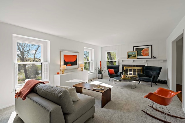 5 Shore Rd, North Oaks, MN 55127 - living area featuring a glass covered fireplace, carpet flooring, and baseboards