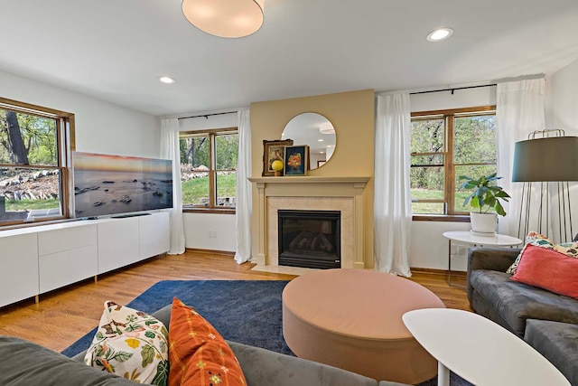5 Shore Rd, North Oaks, MN 55127 - living room featuring plenty of natural light, recessed lighting, a tile fireplace, and wood finished floors