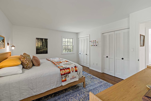 5 Shore Rd, North Oaks, MN 55127 - bedroom with multiple closets, wood finished floors, and baseboards