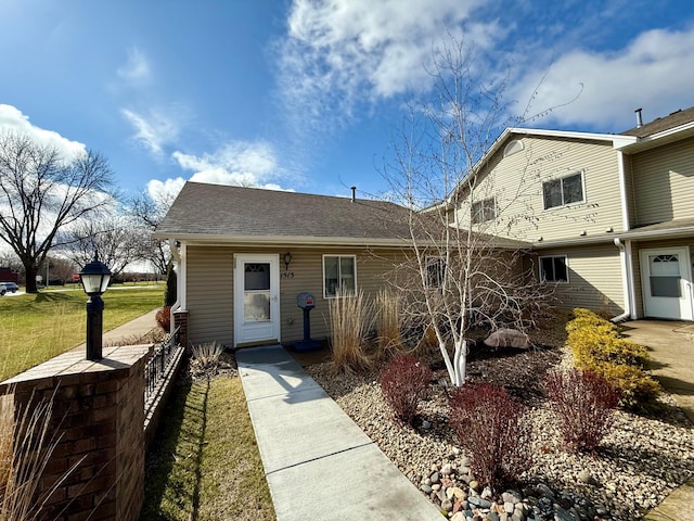 1513 Creek Meadows Dr NW, Coon Rapids, MN 55433 - view of front of home with a front lawn and roof with shingles