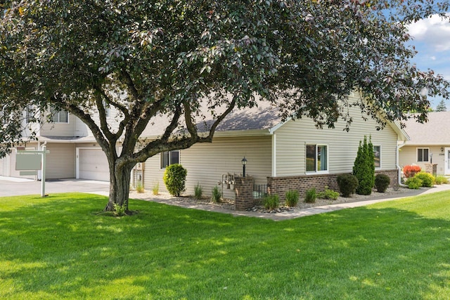 1513 Creek Meadows Dr NW, Coon Rapids, MN 55433 - view of side of property featuring brick siding, a yard, driveway, an attached garage, and a shingled roof