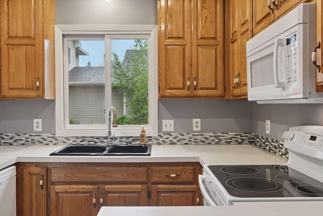 1513 Creek Meadows Dr NW, Coon Rapids, MN 55433 - kitchen with white appliances, backsplash, brown cabinets, and light countertops